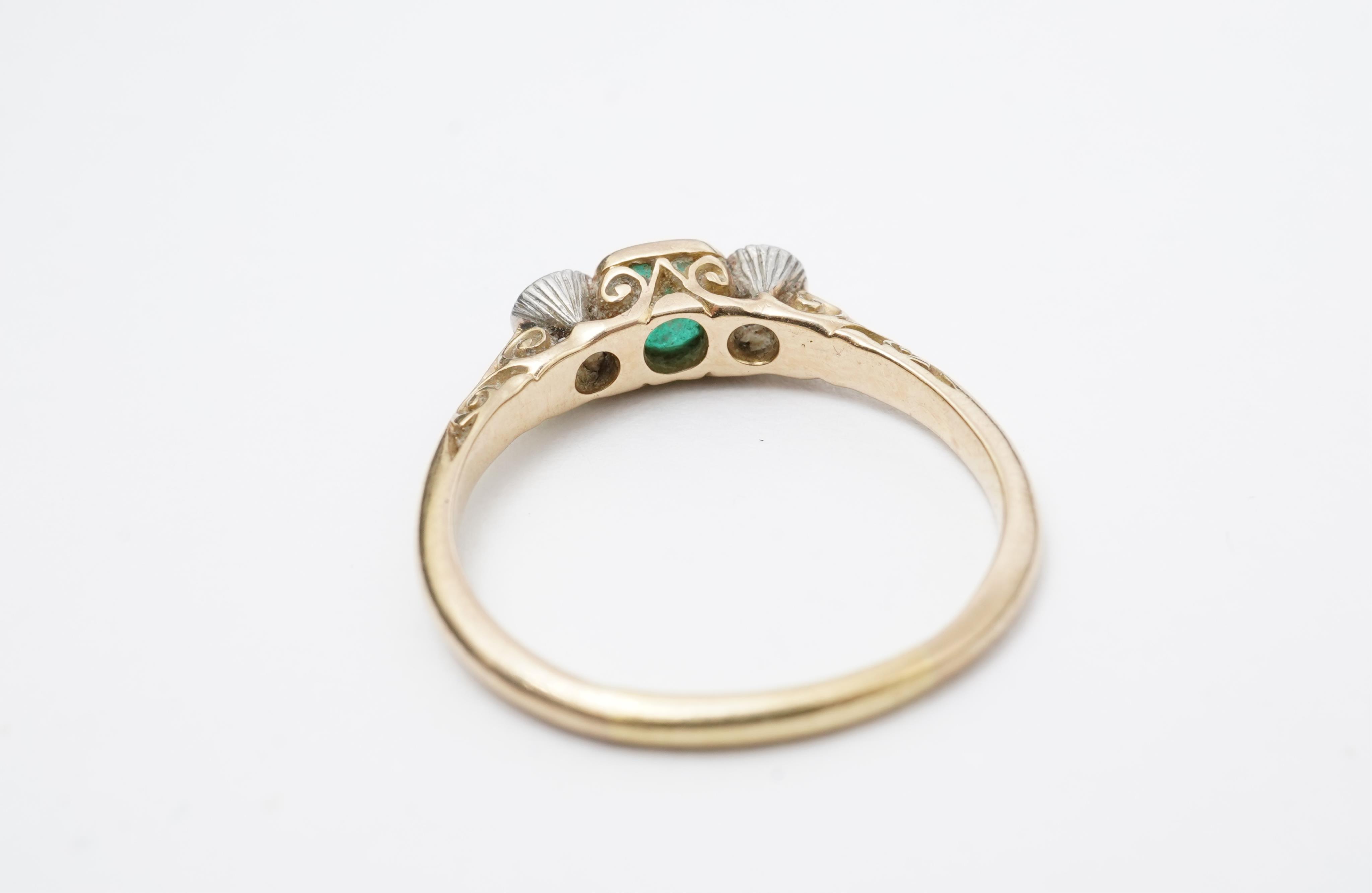 An emerald and diamond ring, early 20th century